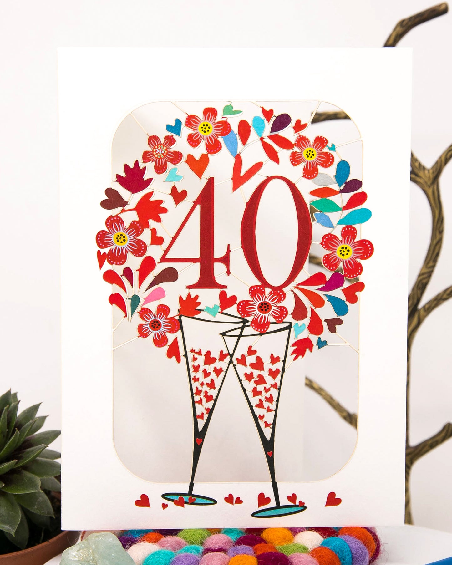 40th Wedding Anniversary Card - Ruby Wedding Anniversary Card that features clanking champagne glasses surrounded with hearts | Dreamy London