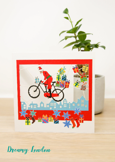 Santa On Bike Christmas Card
