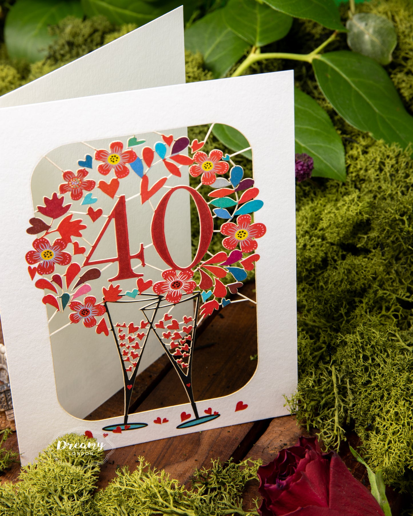 40th Wedding Anniversary Card - Ruby Wedding Anniversary Card that features clanking champagne glasses surrounded with hearts | Dreamy London