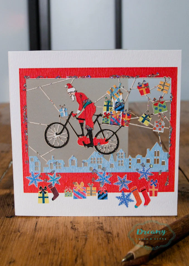 Santa On Bike Christmas Card